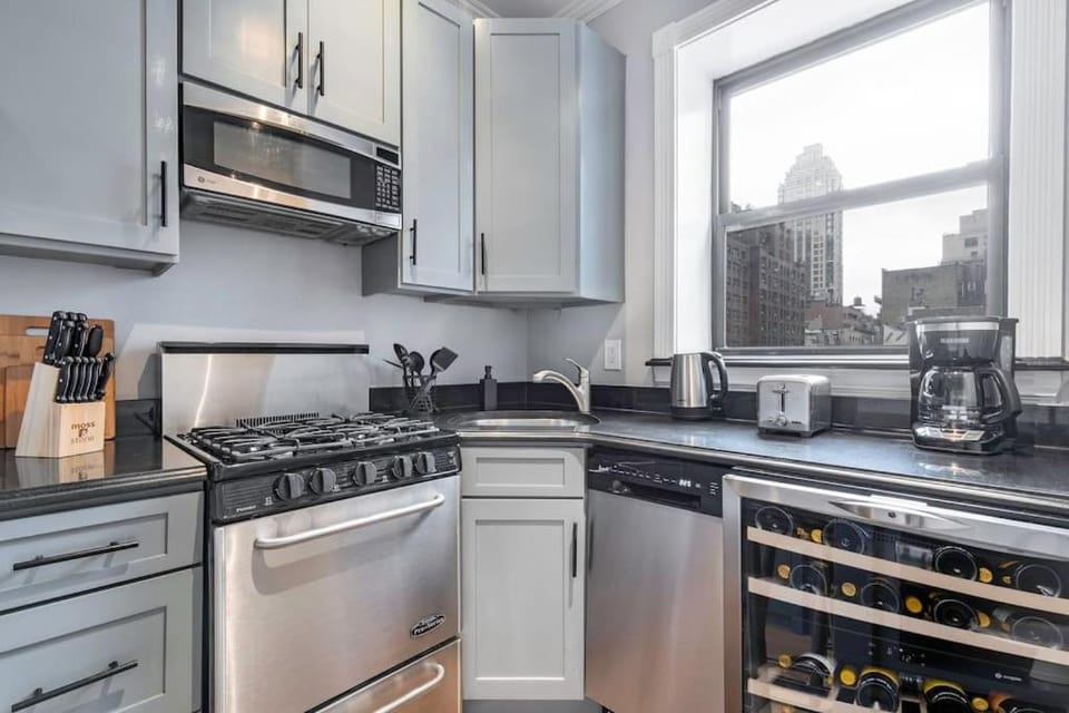 Kitchen or kitchenette, dishwasher, oven, stove, toaster