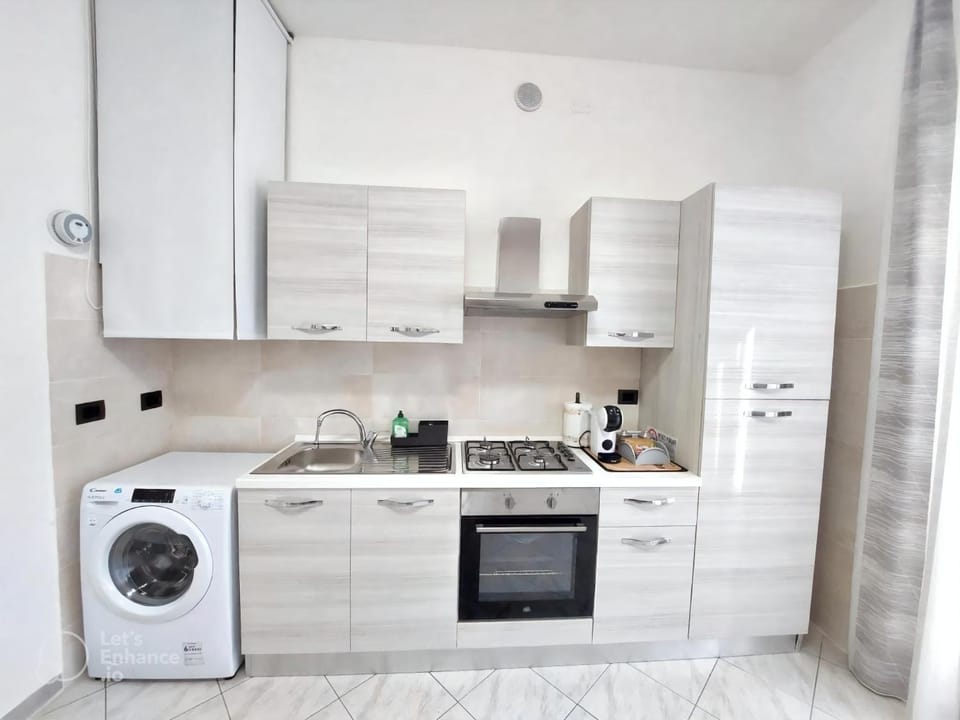Kitchen or kitchenette, oven, stove, toaster, washing machine, kitchen