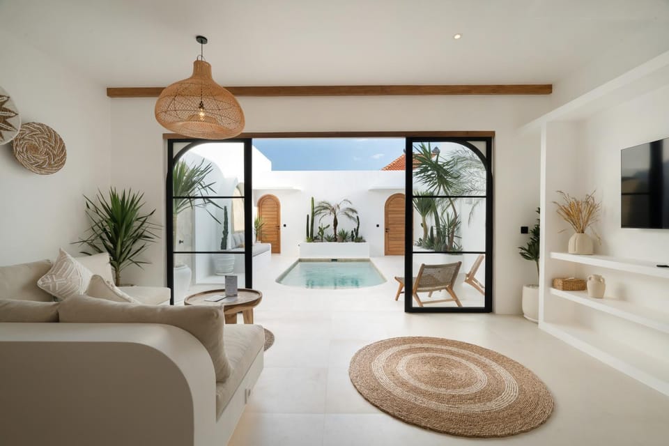 Property building, TV and multimedia, View (from property/room), Living room, Seating area, Pool view