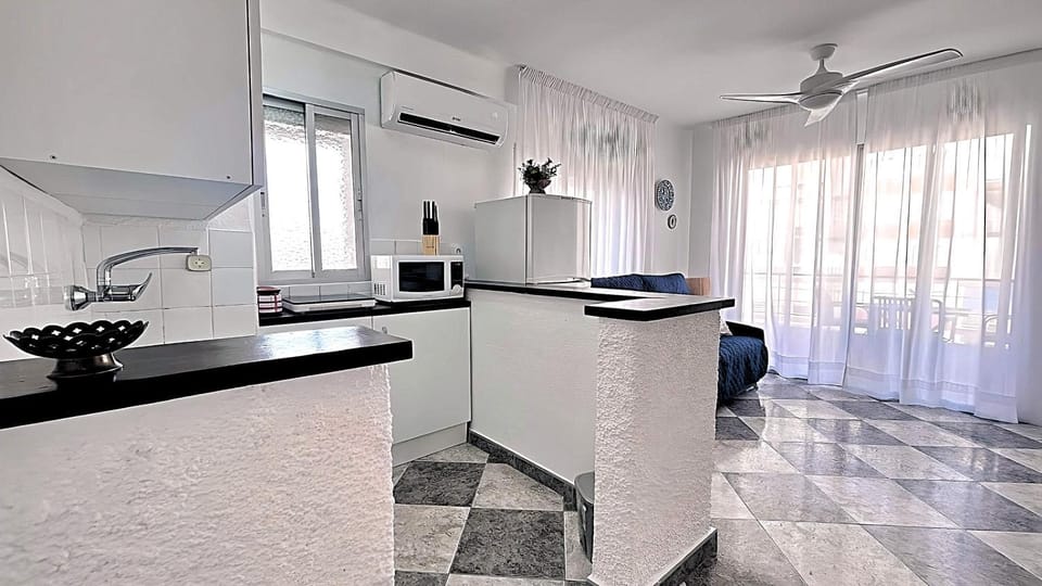 Kitchen or kitchenette, microwave, stove, air conditioner