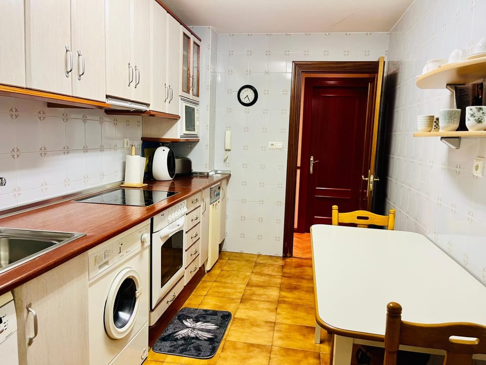 Kitchen or kitchenette, dishwasher, oven, stove, washing machine