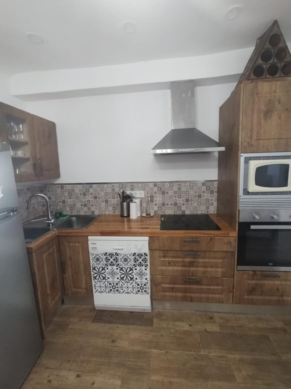 Kitchen or kitchenette, dishwasher, oven, stove