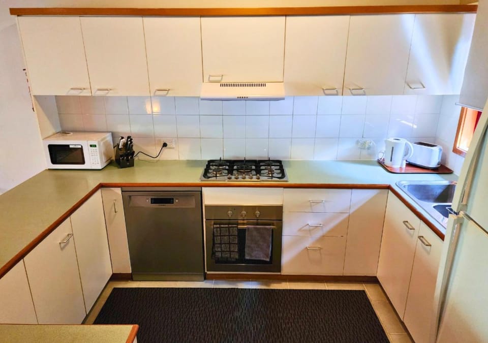 Kitchen or kitchenette, dishwasher, oven, stove, toaster, kitchen