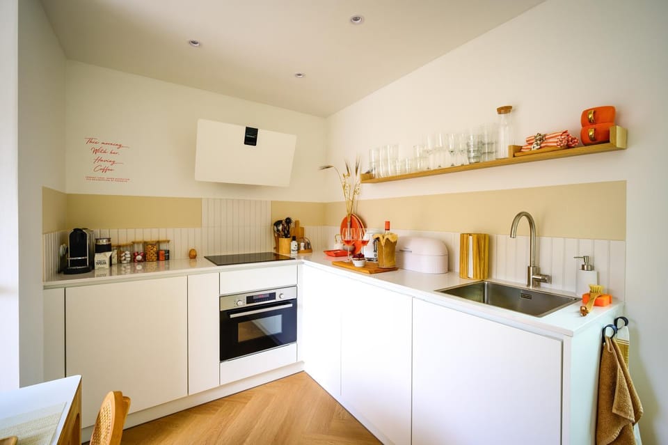 Kitchen or kitchenette, dishwasher, oven, stove