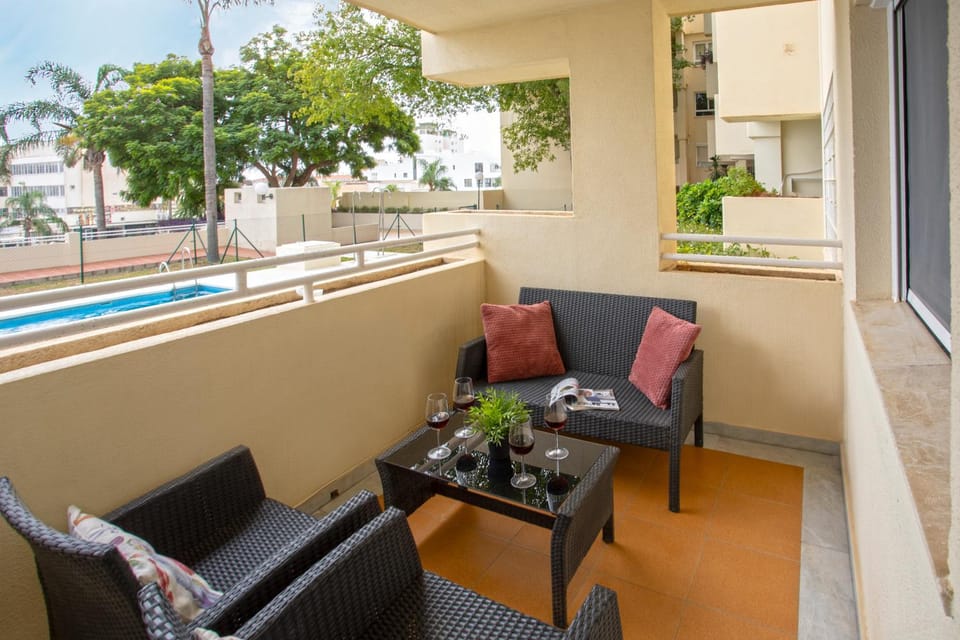 Patio, Day, View (from property/room), Balcony/Terrace, Living room, Seating area, Pool view, Swimming pool