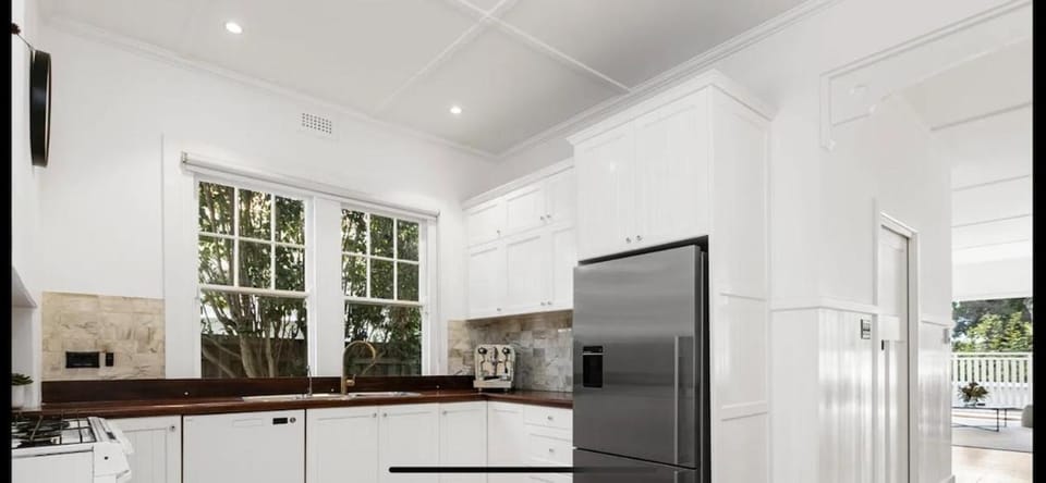 Kitchen or kitchenette, dishwasher, oven, stove