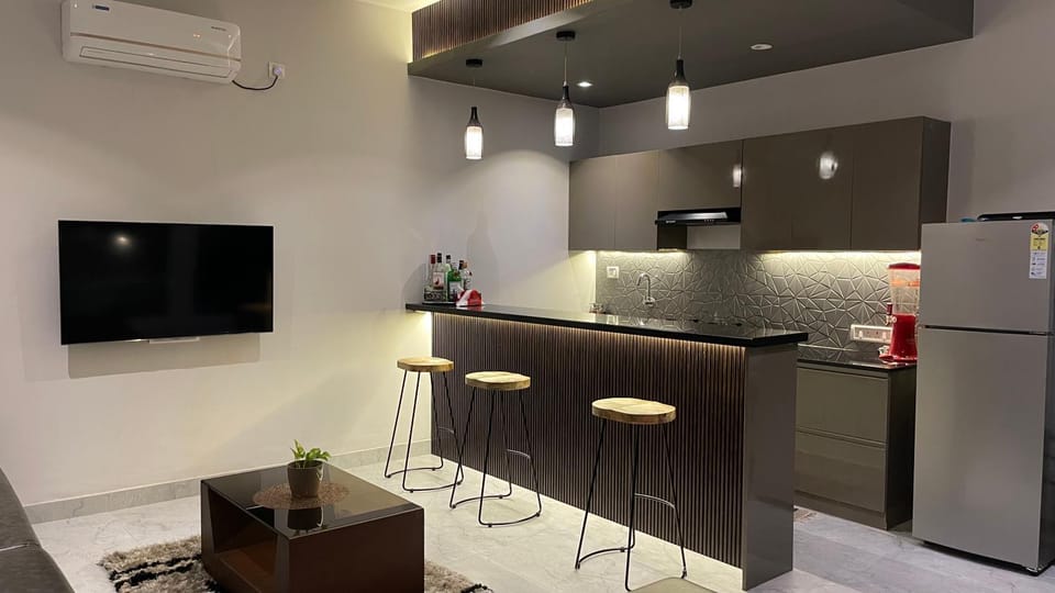 Kitchen or kitchenette, stove, air conditioner