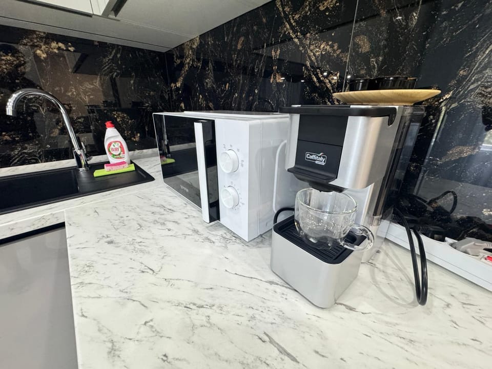 Kitchen or kitchenette, washing machine