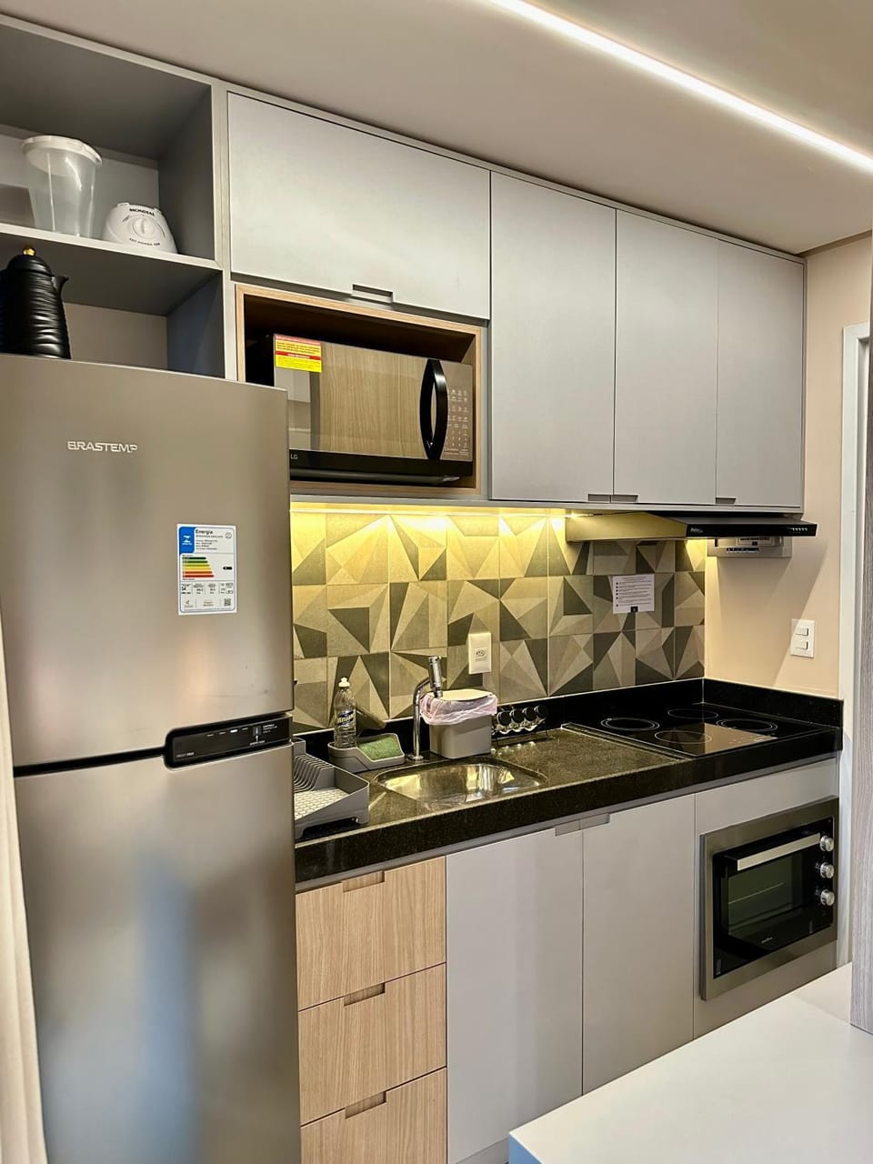 Kitchen or kitchenette, microwave, oven, stove