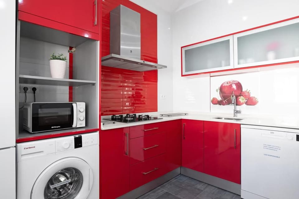 Kitchen or kitchenette, dishwasher, microwave, stove, washing machine