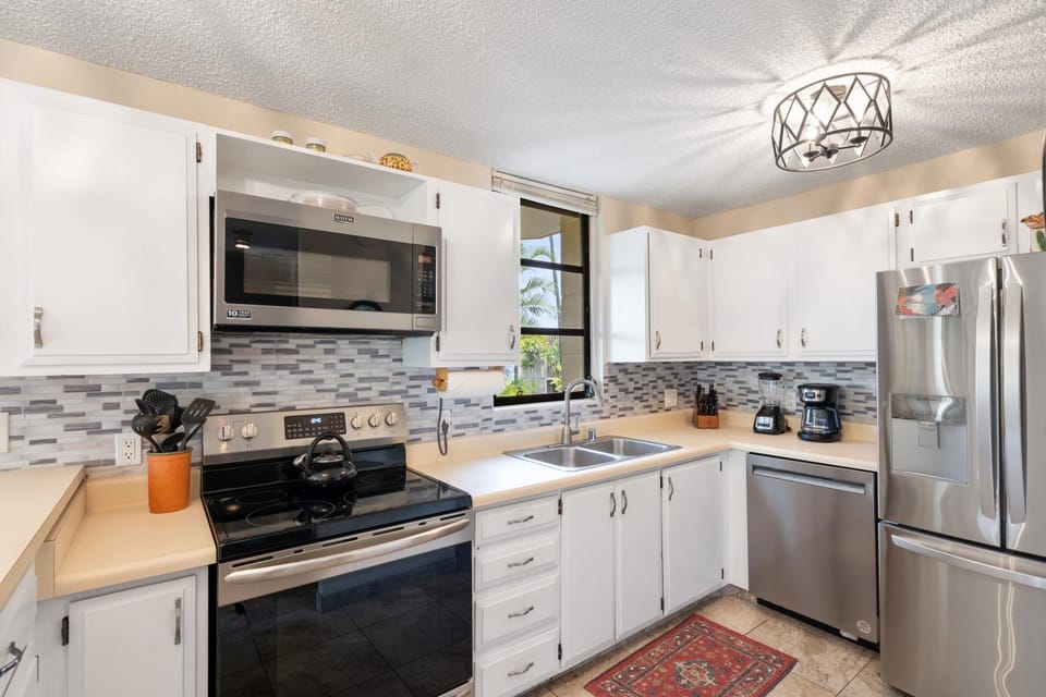 Kitchen or kitchenette, dishwasher, oven, stove, toaster