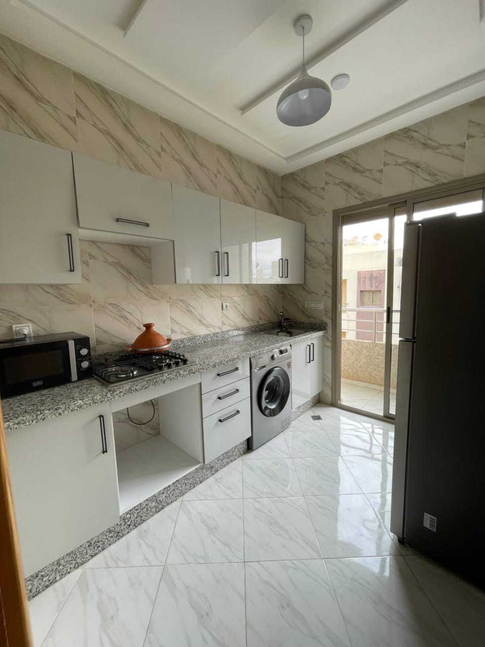 Kitchen or kitchenette, oven, stove, washing machine, dryer