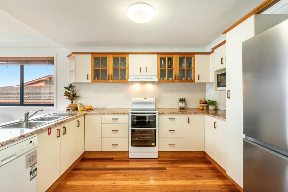 Kitchen or kitchenette, dishwasher, oven, stove