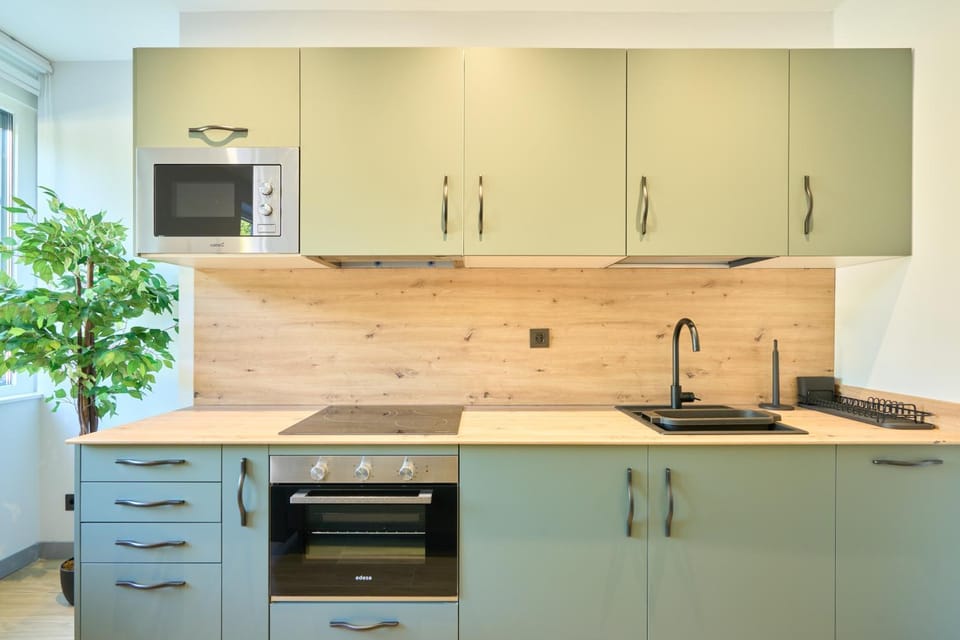 Kitchen or kitchenette, dishwasher, microwave, stove, washing machine, dryer