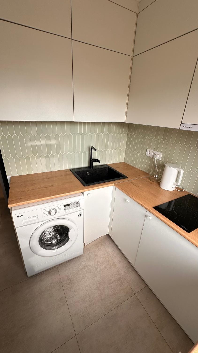 Kitchen or kitchenette, stove, washing machine