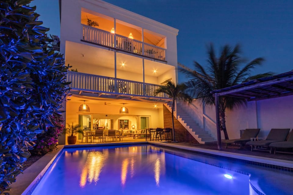 Property building, Patio, Night, Balcony/Terrace, Pool view, Swimming pool, Swimming pool, sunbed