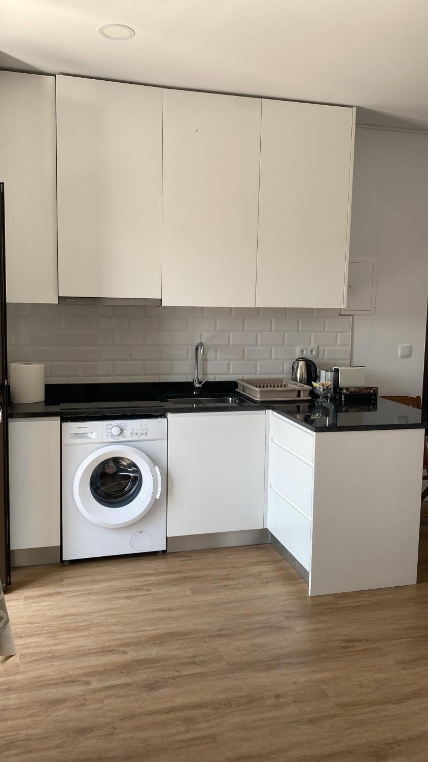 Kitchen or kitchenette, washing machine