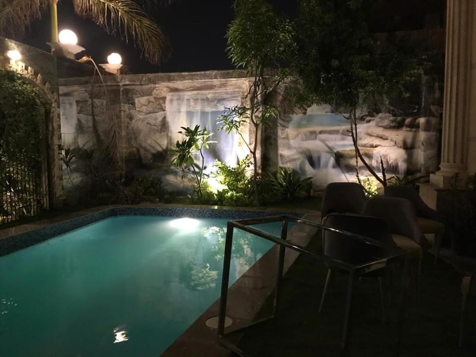 Patio, Night, Pool view, Swimming pool, Swimming pool, sunbed