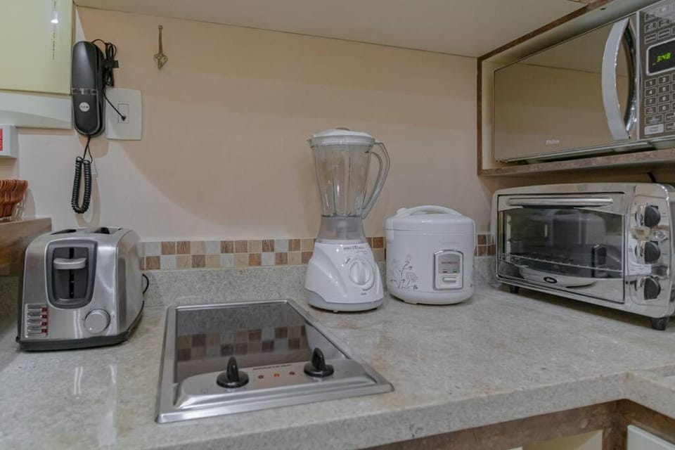 Kitchen or kitchenette, microwave, oven, toaster