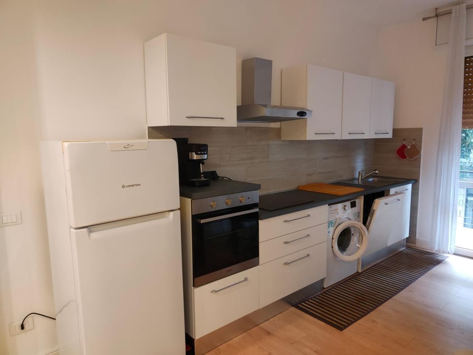 Kitchen or kitchenette, dishwasher, oven, stove, washing machine