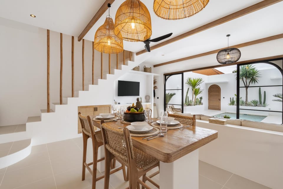 Property building, TV and multimedia, View (from property/room), Living room, Seating area, Dining area, Pool view