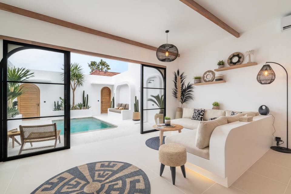 Property building, View (from property/room), Living room, Seating area, Pool view