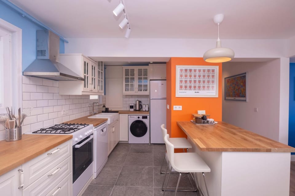 Kitchen or kitchenette, dishwasher, oven, stove, toaster, washing machine, dryer