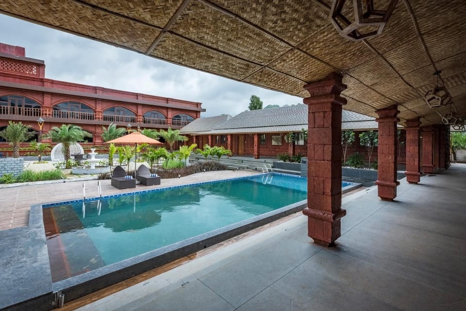 Property building, Seating area, Pool view, Swimming pool, sunbed