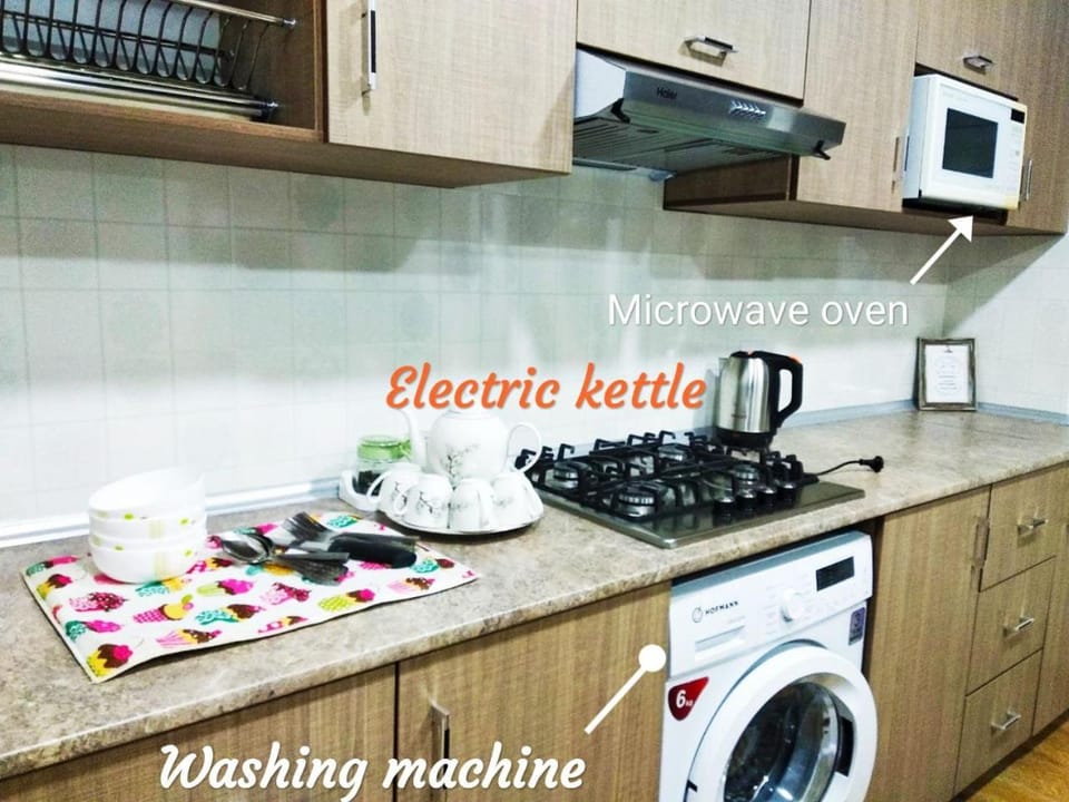 Kitchen or kitchenette, Text overlay, stove, washing machine