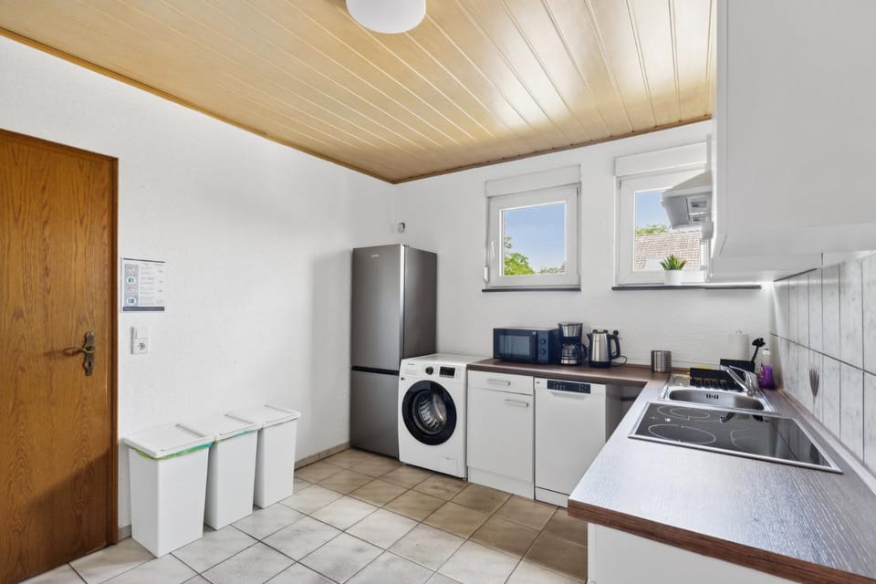 Kitchen or kitchenette, dishwasher, oven, stove, washing machine
