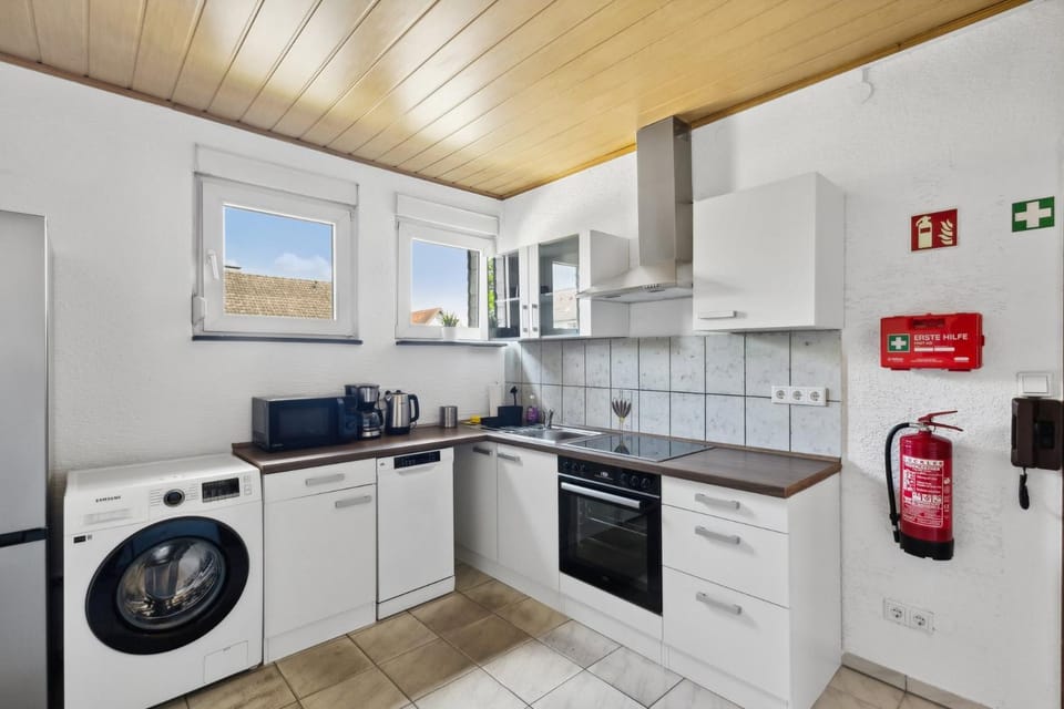 Kitchen or kitchenette, dishwasher, oven, stove, washing machine