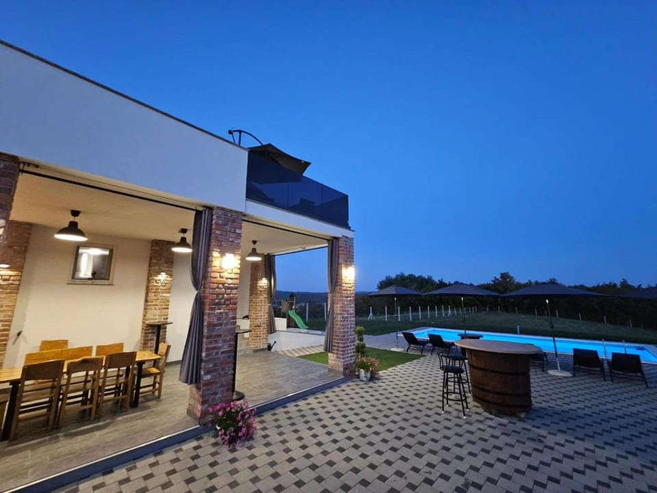 Property building, Patio, Night, Natural landscape, Pool view, Swimming pool, sunbed