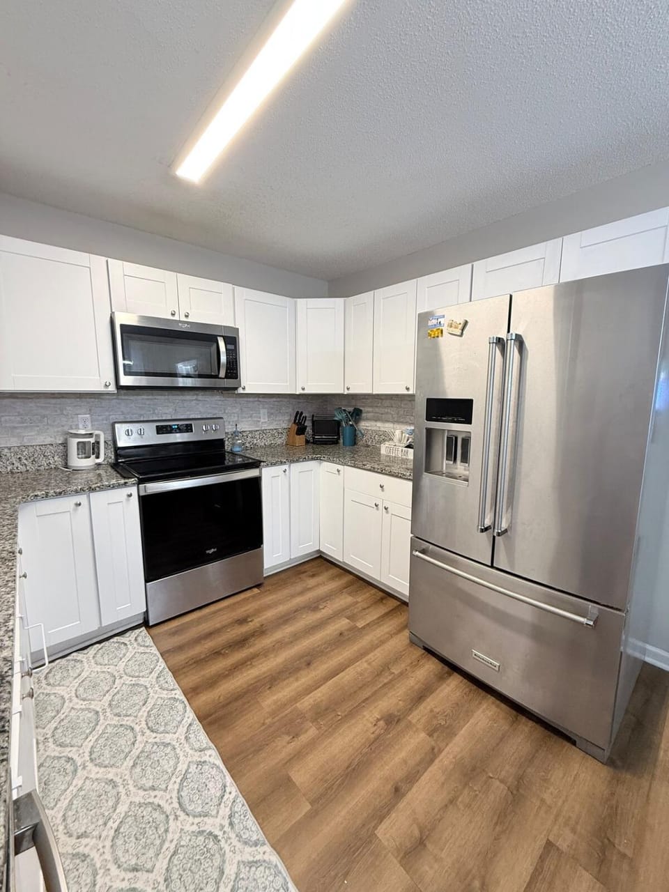 Kitchen or kitchenette, dishwasher, oven, stove, toaster