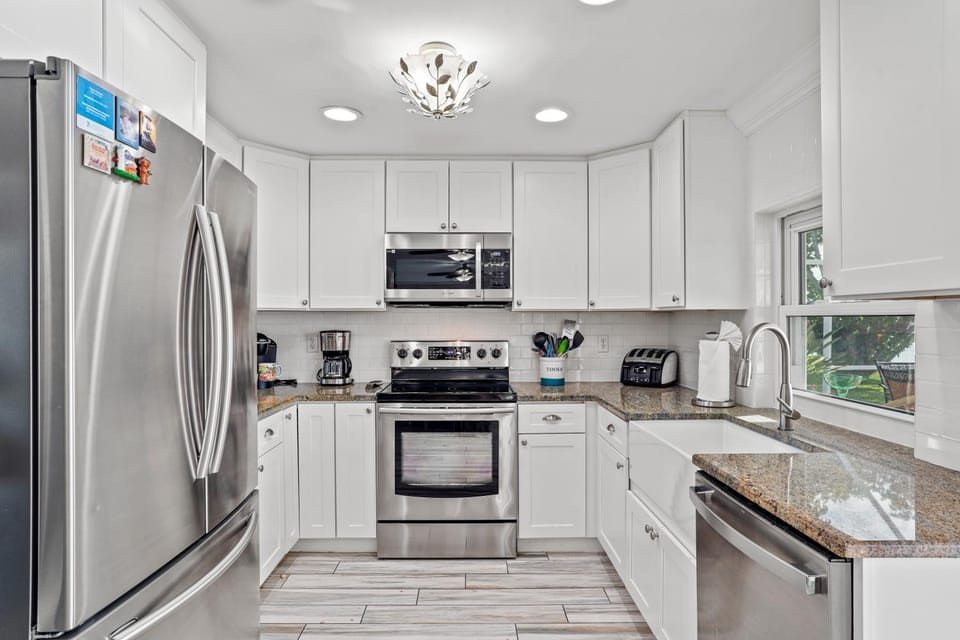 Kitchen or kitchenette, dishwasher, oven, stove, toaster, dryer