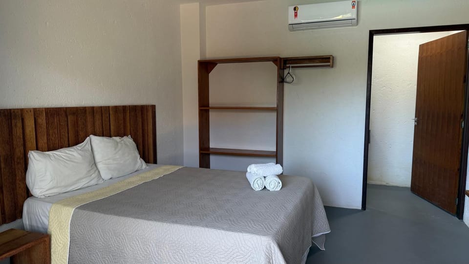 Bed, Bathroom, locker, towels, wardrobe, air conditioner