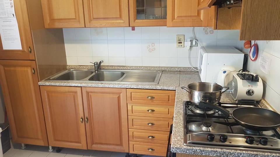 Kitchen or kitchenette, stove