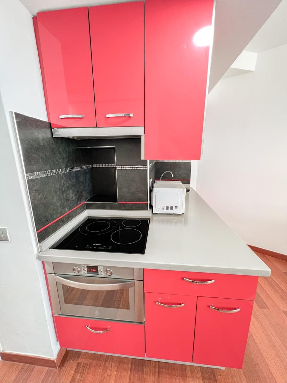 Kitchen or kitchenette, microwave, oven, stove