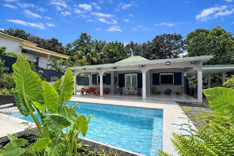 Property building, Patio, Pool view, Swimming pool, sunbed