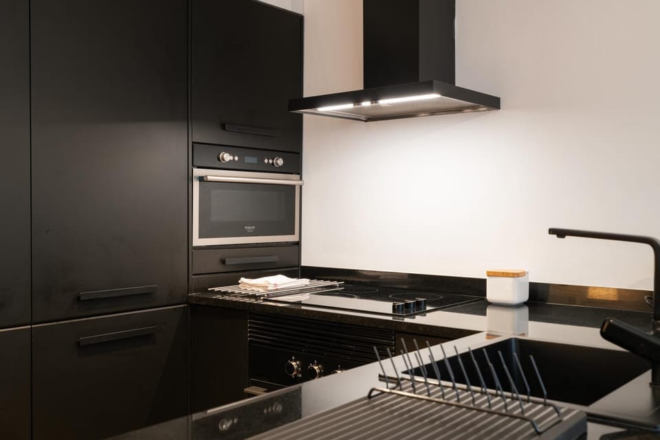 Kitchen or kitchenette, dishwasher, oven, stove