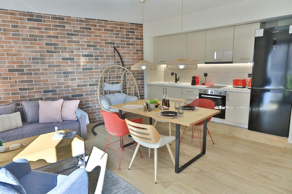 Kitchen or kitchenette, Living room, Seating area, Dining area, oven, stove, toaster, kitchen
