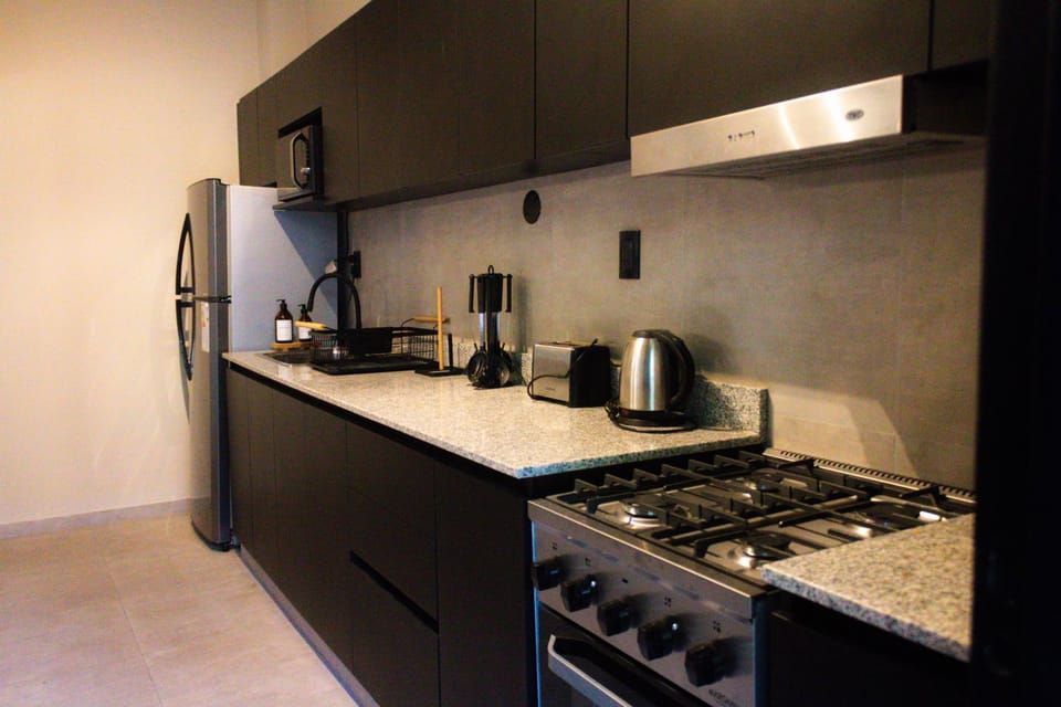 Kitchen or kitchenette, microwave, stove, toaster