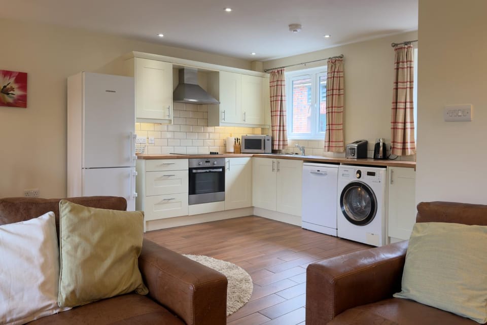 Kitchen or kitchenette, dishwasher, stove, toaster, washing machine