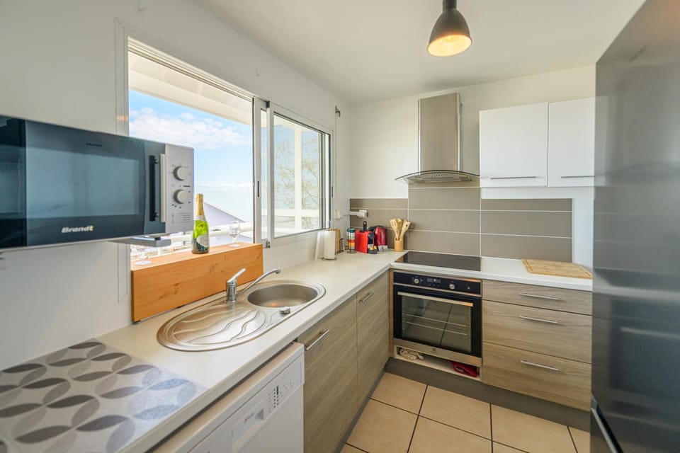Kitchen or kitchenette, dishwasher, oven, stove