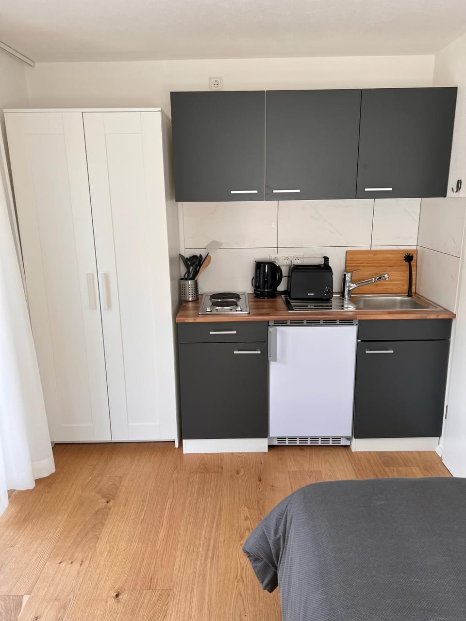Kitchen or kitchenette, stove, toaster