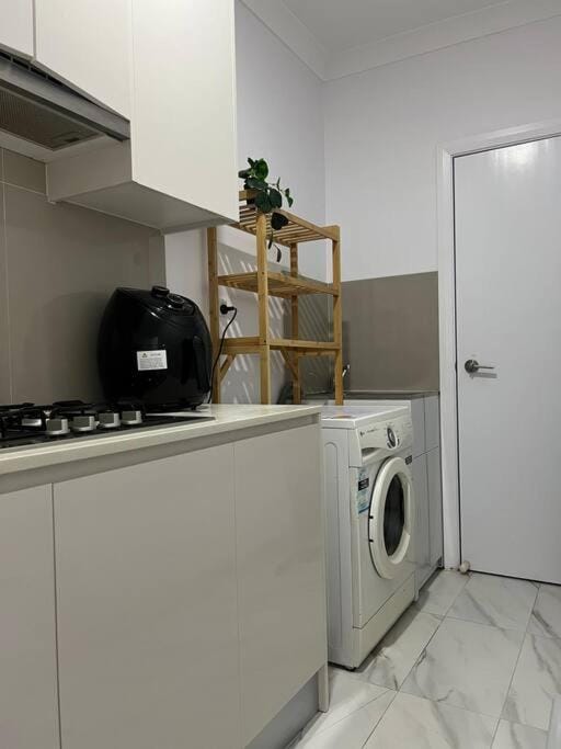 Kitchen or kitchenette, washing machine