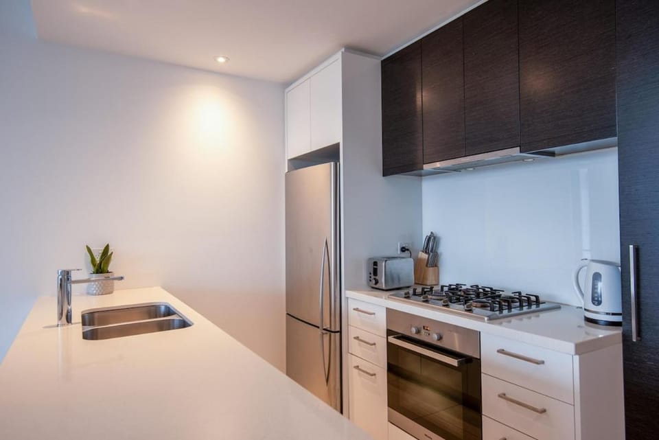 Kitchen or kitchenette, dishwasher, oven, stove