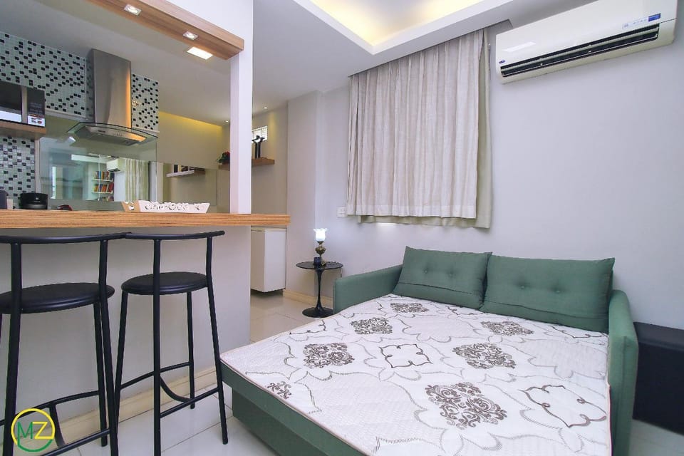 Modern living room and bedroom at post 4 in Copa Apartment in Rio de Janeiro