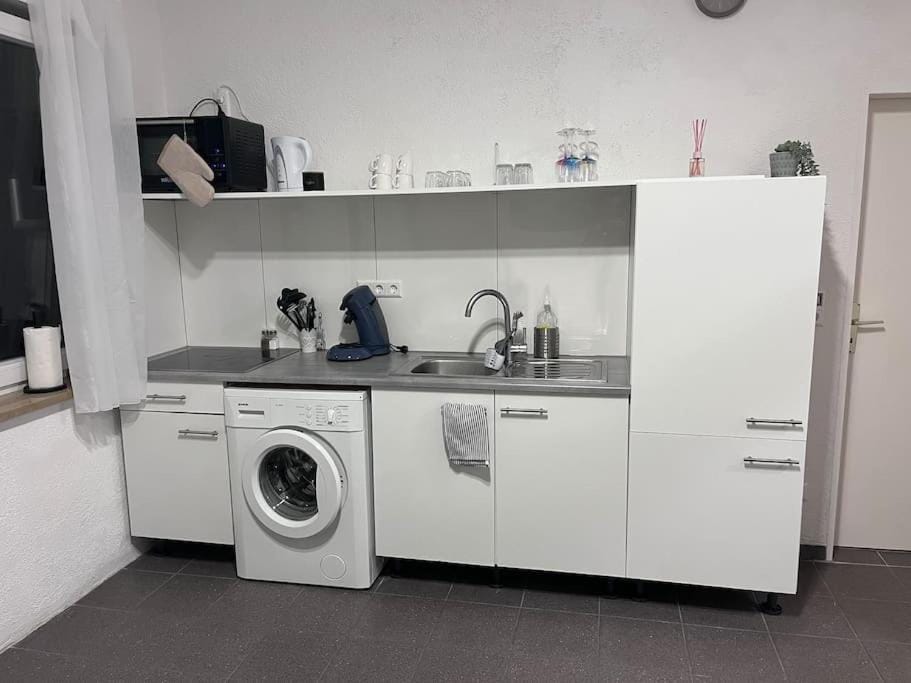 Kitchen or kitchenette, washing machine