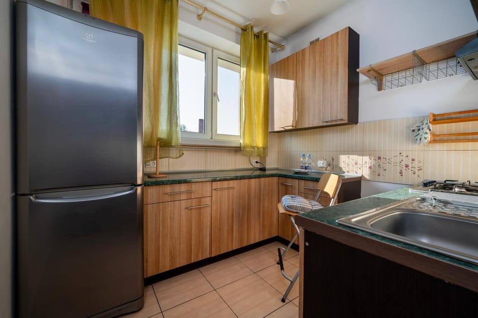 Kitchen or kitchenette, dishwasher, oven, stove