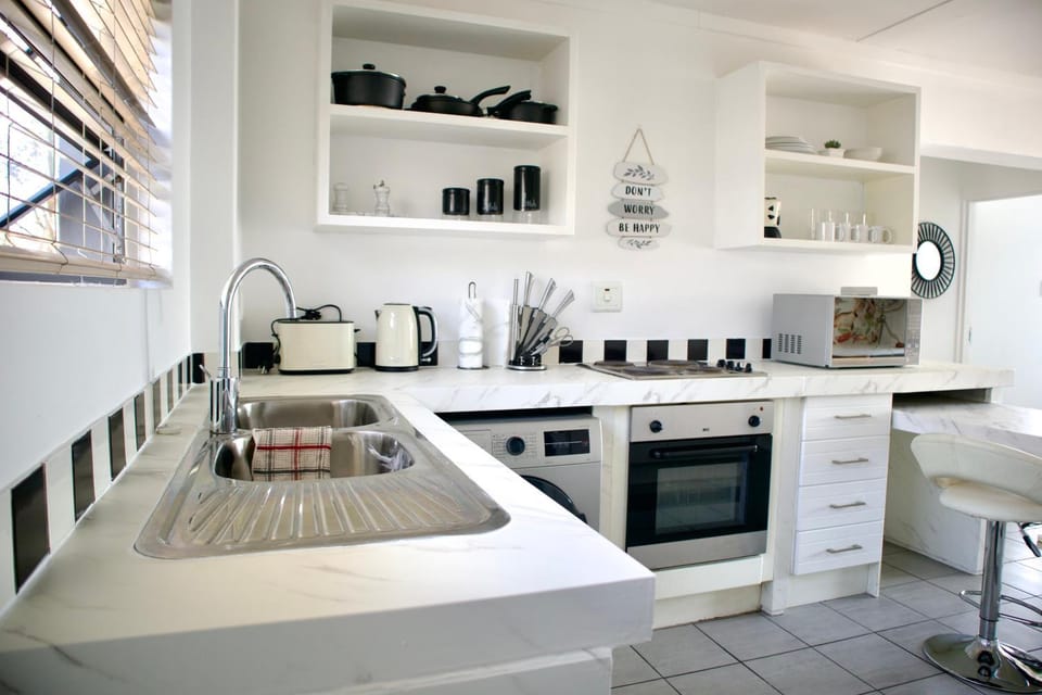 Kitchen or kitchenette, microwave, stove, toaster